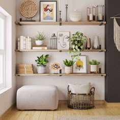 a living room with shelves filled with plants and pictures