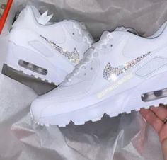 Your Custom Unique White Sparkly Crystal Nike Air Max 90 shoes are fully custom hand crystallised and guaranteed to bring some sparkly BLING to your life! These Nike Air Max 90 Trainers are 100% unique with no two pairs the same. Super comfortable shoes! 𝕀𝕄ℙℝ𝔼𝕊𝕊 𝔼𝕍𝔼ℝ𝕐𝕆ℕ𝔼 with these custom Crystalized Air Max Kicks today! Size: Please contact us if unsure on what size you need.  UK 2 / EU 34 / Girls 2.5Y UK 2.5 / EU 35 / Girls 3Y UK 3 / EU 35.5 / Girls 3.5Y UK 3.5 / EU 36 / Girls 4Y / White Bling Lace-up Sneakers, White Custom Sneakers With Bling, Round Toe, White Low-top Custom Sneakers With Bling, White Custom Lace-up Sneakers With Rhinestones, White Lace-up Custom Sneakers With Rhinestones, Womens Air Max 90, Sick Shoes, 90 Shoes, Swarovski Nike