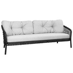 a black and white couch with pillows on it