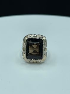 "This is a beautiful natural Smokey Quartz sterling silver ring size 7.5. The deck of this ring measures approximately 21.5 x 18.5 MM. The Smokey Quartz stone is emerald cut, has an amazing deep color, and is high quality as it is flawless. This ring is also stamped 925 and \"MEX\" as it was made in Mexico. This ring was handmade and it is very unique.This ring weighs 7.9 grams. This ring is new and unworn." Formal Sterling Silver Signet Ring With Rectangular Stone, Modernist Sterling Silver Wedding Rings, Silver Rectangular Sapphire Ring, Silver Sapphire Ring With Rectangular Gemstone, Silver Topaz Ring With Rectangular Stone For Promise, White Gold Sterling Silver Ring With Rectangular Stone, Classic Emerald-cut Topaz Ring In Sterling Silver, Modernist Hallmarked Wedding Rings, Octagon Shaped Sterling Silver Topaz Ring