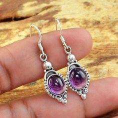 Amethyst 925 Sterling Silver Earring, Handmade Silver Earring, Bali Design Silver Jewelry, Boho Jewelry, Handmade Jewelry 💎Gemstone: Amethyst 💎Material : 925 Sterling Silver 💎Stone Type : Natural 💎Quality: AAA Vintage Solid Silver large Boho Designs Our Handmade Jewelry: ✔️have 15 days return policy 💌 Shipping information All Our Jewelry Is Carefully Shipped With Track Number.... Silver Amethyst Teardrop Jewelry, Silver Teardrop Amethyst Jewelry, Sterling Silver Jewelry With Bail Detail, Amethyst Dangle Earrings Stamped 925, Purple Dangle Jewelry Stamped 925, Hallmarked Silver Amethyst Jewelry, Amethyst Round Jewelry Stamped 925, Purple Jewelry For Making, Stamped 925, Sterling Silver Drop Earrings With Bail