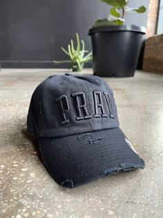 Lookin' for a way to keep your head up? Put on our PRAY Hat and show off your faith ~ it's distressed for a vintage vibe that'll have 'em turning their heads (in a good way!). Not to mention, it comes in tons of colorways, plus a handy strap-back closure for adjustable fit. Live your life by the motto: Pray & Slay! Jesus Hats, Casual Hat Outfit, Christian Caps, Hat Design Ideas, Church Merch, Trendy Hats, Christian Accessories, Christian Hats, Christian Shirts Designs