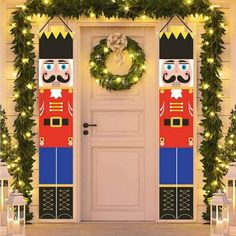 christmas decorations on the front door of a house with wreaths and lights around it