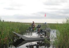 a man on a small boat in the water