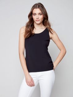 Description Stock up on this versatile tank top for women – it’s reversible, meaning you can wear it with the front scoop neckline, or the other side’s V neckline. New day, new shirt! Available in all the must-have neutrals. Go back to basics in this Black camisole for women. Front crew neck, back V neckline Reversible women’s top Relaxed fit Why we love it Made from the cellulose of bamboo, you’ll love the silky, soft feel of this women’s camisole. It’s the perfect layering tank top, and it’s e Layering Tank Tops, Tank Top For Women, Black Camisole, Layering Tanks, Womens Cami, Black Camis, Spring Summer 2023, Back To Basics, Natural Curves