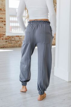 Elevate your wardrobe with our Harvey Lace-up Waist Harem Pants! Crafted with a unique lace-up waist design, these pants not only provide a stylish touch but also offer a comfortable fit. Perfect for any occasion, our harem pants will make you stand out from the crowd. Upgrade your style today! Model Info: Models are 5'7", Size 2, wearing smalls Material: 65% Polyester + 35% Cotton Sizes Trousers_Waist Hip Bottoms Inseam Outseam Relax Relax Relax Relax Relax S 25.6 44.9 27.8 26.7 39.8 M 27.6 47. Baggy High-waist Joggers With Elastic Waistband, Baggy High Waist Joggers For Loungewear, High Waist Baggy Joggers With Elastic Waistband, High Waist Drawstring Pants, Baggy High-waist Cargo Pants For Loungewear, Baggy High Waist Cargo Pants For Loungewear, High Waist Relaxed Fit Bottoms With Drawstring, Trendy Full Length Drawstring Bottoms, Trendy Full Length Bottoms With Drawstring