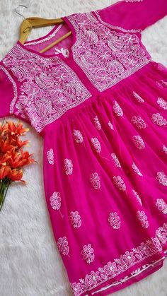 Kurti Fabric : Georgette Sleeves : 3/4 Sleeves Style : Peplum Top Kurti Length : 30-32 inches Occasions : Casual Wear, Office Wear, Festive Wear Garment Care : Hand Wash Only Price Includes : Kurti, Sharara with inner Note : Embroidery may be little vary due to vary human hand involvement. Pink Resham Embroidery Kaftan For Festivals, Pink Resham Embroidery Kaftan For Diwali, Pink Anarkali Kaftan For Navratri, Pink Anarkali Kaftan For Festive Occasions, Traditional Pink Georgette Kaftan, Festive Georgette Kaftan With Chikankari Embroidery, Festive Kaftan With Chikankari Embroidery, Pink Anarkali Kaftan For Festivals, Chikankari Embroidery Saree Kaftan For Diwali