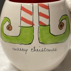 a coffee cup with christmas stockings on it