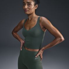 Move effortlessly from your morning walk to all the activities that follow in this stretchy, sweat-wicking tank top that feels like a second skin. The fully sewn-in bra helps resist shifting and offers medium support that gives you a snug hold, helping keep everything in place. Nike Yoga Sports Bra With Built-in Bra, Nike Sports Bra With Built-in Bra For Yoga, Nike Activewear With Built-in Bra For Workout, Athleisure Tank Top With Built-in Bra And Medium Support, Sporty Green Tops With Built-in Bra, Sportswear Tank Top With Built-in Bra For Training, Nike Yoga Top With Built-in Bra, Sporty Yoga Tank Top Bra Friendly, Sporty Bra-friendly Tank Top For Yoga