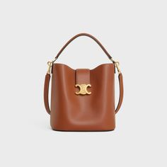 MEDIUM LOUISE BAG IN SMOOTH CALFSKIN - TAN | CELINE Quite Luxury Bags, High-end Bucket Satchel With Detachable Handle, High-end Satchel With Bucket Shape And Detachable Handle, High-end Tan Shoulder Bag, High-end Bucket Shoulder Bag For Daily Use, High-end Bucket Bag, High-end Everyday Bucket Shoulder Bag, Everyday High-end Bucket Shoulder Bag, High-end Bucket Satchel