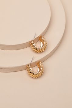 Let your luxe persona shine through with the Lulus Alendra Gold Textured Hoop Earrings! Shiny, gold-toned metal shapes these stunning earrings that have a classic hoop silhouette with a bold presence and a striking, ribbed-liked texture across the surface. Post Backs. Earrings Measure 0. 75" In Diameter. 100% Zinc. Imported. Lulus | Alendra Gold Textured Hoop Earrings. Earring Product Photography, Hoop Earrings Chunky, White Gold Earring, Chunky Hoop Earrings, Lulu Fashion, Casual Wedding Dress, White Gold Earrings, Gold Earring, Accessories Jewelry Earrings