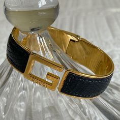 Gucci Black Python Gold Fashion Bangle/Bracelet Vintage Jewelry. Beautiful. Good Condition. Normal Wear & Tear. Has Slight Scratches, Throughout, On The Gold Areas. Python Skin Is Intact. Spring Hinge, Works Good. No Tarnishing. Size: 2 5/8” Length Est 2” Width Est 5/8” Band Width Est It Has Been Authenticated By Realauthentication.Com, One Of Poshmarks Approved Vendors. Does Not Come With Original Box. You Will Get A Box And Little Satchel. Not Gucci Package. Sorry. Classic Gucci Bangle Bracelets, Designer Black Cuff Bracelet For Formal Occasions, Gucci Classic Yellow Gold Bracelet, Elegant Gucci Bracelets For Formal Occasions, Designer Cuff Bracelet Bangle For Evening, Elegant Gucci Formal Bracelets, Elegant Black Gucci Jewelry, Classic Gucci Bangle Jewelry, Gucci Yellow Gold Bracelets For Formal Occasions