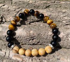 Carry your crystals and Palo Santo everywhere you go. Our specially designed handmade Palo Santo bracelets are made of natural Palo Santo beads, Tiger Eye and Black Tourmaline stones, bracelets come in different sizes according to your wrist measurements, and for children too.  Wear them to help raise your vibrations, cleanse your energy and draw good energy in, they can be a wonderful gift for your friends, family, and loved ones too! Available in flexible sizes for adults and children, measure Spiritual Adjustable Beaded Bracelets With Stones, Handmade Crystal Bracelet With Round Beads For Meditation, Adjustable Spiritual Beaded Bracelet With Stones, Adjustable Stretch Bracelet With Round Beads And Stones, Adjustable Stretch Bracelet With Round Stones, Adjustable Crystal Bracelet With Stones For Meditation, Adjustable Beaded Bracelets With Round Stones, Adjustable Stone Beaded Bracelets For Meditation, Adjustable Beaded Bracelets With Stones For Meditation