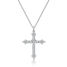 A beautiful symbol of faith, this cross necklace is worth keeping and will become a treasured trinket in your jewelry box. Featuring cubic zirconia of different shapes and a layer of platinum plating, the style is made exquisitely and will shimmer always. CUT & DESIGN: The stunning round-cut & heart-cut stone with prong-setting creates an impressive necklace for holy style STONE: Sparkling clear Cubic Zirconia stone METAL TYPE: Platinum-plated Sterling Silver MEASUREMENT: 18'' cable chai Silver Diamond-cut Necklace, Silver Crystal Cross Pendant Necklace, Cubic Zirconia Diamond-cut Necklace, Silver Cubic Zirconia Cross Pendant Necklaces, Silver Cubic Zirconia Diamond-shaped Necklace, Silver Diamond-shaped Cubic Zirconia Necklace, Elegant Silver Cross Diamond Necklace, Diamond White Crystal Cross Necklace, Fine Jewelry Cross Pendant Necklace With Vvs Clarity