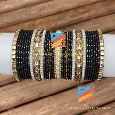 Golden Black Polki Kundan Bangle Set can be customized with any Bangle or Kada. - Talk to us to Add or Remove any bangle and adjust pricing. - Price shown is for Both Hands Explore more INDIAN BANGLES, Indian Kada, CHURA, Bridal Kada 👉 PUNJABI BRIDAL JEWELLERY ONLINE 💁🏻‍♀️Kamalika, US ⭐️⭐️⭐️⭐️⭐️ Great collection. Prompt delivery. Exceeded my expectations- more beautiful than the picture. Love the packaging which comes with a 'Thank You' note. Great customer care. Very happy with whatever I pu