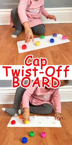 two children sitting on the floor playing with their hands and fingers in front of a sign that says cap twist - off board