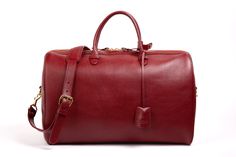 Red Red Travel Bag With Leather Handles, Elegant Rectangular Duffle Bag For Overnight Trips, Red Rectangular Bags For Business Trips, Red Tote Duffle Bag For Everyday Use, Red Duffle Bag Tote For Everyday Use, Rectangular Red Bags For Business Trips, Luxury Red Travel Bag For Everyday Use, Luxury Everyday Satchel Duffle Bag, Red Leather Luxury Travel Bag