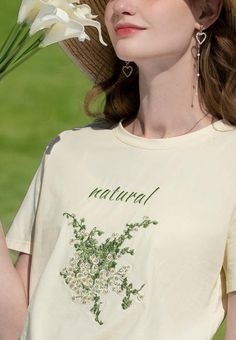 Bask in the pastoral allure of our Cottagecore Natural Tee. This breathable cotton-polyester top showcases high-quality floral embroidery. It's an idyllic addition to your wardrobe, evoking a serene, nature-inspired vibe, setting you apart from the urban crowd. Cottagecore aesthetic Cotton, polyester Crew neck High quality floral embroidery at front Short sleeve Beige Short Sleeve Tops With Floral Embroidery, Cottagecore Floral Embroidery T-shirt For Summer, Embroidered Cotton Tops For Spring, Beige Floral Embroidery Relaxed Fit Tops, Cream Floral Embroidered Summer Tops, Beige Relaxed Fit Top With Floral Embroidery, Beige Floral Embroidered Cotton Tops, Cream Cotton Top With Floral Embroidery, Spring Crew Neck Tops With Floral Embroidery