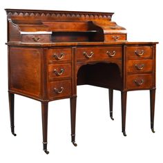 an antique wooden desk with two drawers