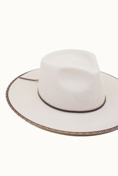 Look your best in the Avril White Rancher hat. It's crafted from quality wool felt for a classic look and feel that will last. The detailed trim and adjustable inner velcro strap ensure a comfortable fit. Show off your style with this timeless rancher! Felt Hat Bands For Rodeo With Flat Brim, Felt Hat Bands For Rodeo, Adjustable Felt Hat For Ranch, White Wool Hat With Flat Brim, Western Wide Brim Felt Hat Bands, Adjustable Western Felt Hat, White Wool Flat Brim Hat, White Flat Brim Wool Hat, Curved Brim Felt Hat For Ranch