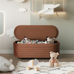 a teddy bear sitting next to an inflatable toy chest