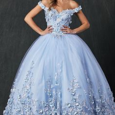 We're Thrilled To Present This Stunning Ball Gown, Which Will Make You Feel Like Royalty. It's A Classic Look That Can Be Worn To Many Different Occasions, And It's Perfect For A Special Night Out. The 3d Floral Embroidery Combined With The Sparkling Rhinestones Creates A Unique Look You Won't Find Anywhere Else. This Dress Is Sure To Turn Heads Wherever You Go! Length: Long Neckline: Off Shoulder Sleeve: Sleeveless Back: Corset, Spaghetti Ties Embellishments: Sequins, Beads Occasion: Romantic D Fitted Gown With Floral Embroidery For Quinceanera, Fitted Floral Embroidered Gown For Quinceanera, Fitted Floral Embroidery Gown For Quinceanera, Floral Embroidered Floor-length Dress For Debutante Ball, Quinceanera Ball Gown With Floral Embroidery, Formal Blue Gown With Floral Embroidery, Floral Embroidered Ball Gown For Quinceanera, Floor-length Light Blue Gown For Quinceanera, Blue Floral Applique Wedding Gown