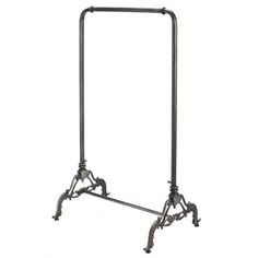 an old fashioned metal rack with two legs