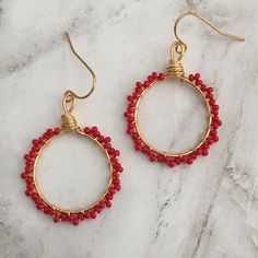 Item Overview - Handmade in Katy, Texas - Materials: Tiny red seed beads, gold wire, gold plated stainless steel ear wire Item Detail - These flattering earrings have tiny red seed beads that are wire wrapped with gold tarnish resistant wire. Light weight, they measure 2 1/2 cm in diameter and hang 3 1/2 cm in length. Perfect for anytime! These earrings will be sent in a gift box. Thanks for looking. Flattering Earrings, Gold And Red Earrings, Red Hoop Earrings, Katy Texas, Earrings Wire, Wrapped Earrings, Gold And Red, Hoop Earrings Gold, Earrings Beaded