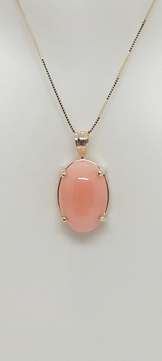 PINK CORAL Oval Pendant 14k Yellow Gold/ Necklace /Charm in 14k Yellow Gold 18 Inches box Chain for a Pink Coral LOVER. Product Info: -Stone: Oval Pink Coral. -Stone Color: Pink. -Metal: 14k Yellow Gold. -Pendant Measures: 18 x 10mm. -Pink Coral Measures: 12 x 9mm -Chain length: 18 Inches box chain. -Nice Gift Box Included. Pink 14k Gold Jewelry With Polished Finish, Formal Pink Cabochon Necklace, Pink Oval 14k Stamped Jewelry, 14k Stamped Oval Pink Jewelry, Pink Oval 14k Gold Necklace, Fine Jewelry Pink Cabochon, Oval Pink Gold Jewelry For Anniversary, Hallmarked Rose Gold Oval Jewelry, Hallmarked Oval Rose Gold Jewelry