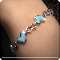 Five beautiful heart-shaped Larimar gemstones are linked with sterling silver hearts in this delightful and fanciful design. 
 
Product Details:  Five 13mm Larimar gemstones and sterling silver. Adjustable from 7" to 8".

View more from the Marahlago Heart Collection! Heart-shaped Sterling Silver Bracelets, Elegant Heart-shaped Sterling Silver Bracelet, Silver Larimar Bracelets As Gift, Pink Heart-shaped Sterling Silver Bracelet, Elegant Larimar Bracelet Jewelry, Blue Stone Bracelet, Sterling Silver Heart Bracelet, Larimar Bracelet, Silver Heart Bracelet