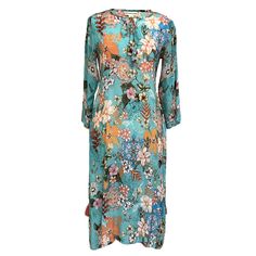 Be Bold. Be beautiful. Stand out in our Corfu Turquoise Midi Dress! It has a round split V-neck with a tie, bold and vibrant tropical print with flowers, and tassels on the side slits. The pattern is colorful with turquoise, blues, yellows, whites, and oranges. Wear it straight or loosely belted (belt included) for a more defined look. And YES, it has POCKETS!  Beach wear, Leisure wear, Comfort wear, Resort wear.  Our Corfu is also available in Fuchsia and Coral. Composition: 100% Viscose Silk Spring Blue Floral Print Kurta, Turquoise Long Sleeve Festive Dress, Festive Turquoise Long Sleeve Dress, Blue Straight Kurta Dresses For Spring, Green Floral Print Maxi Length Kurta, Festive Light Blue Straight Kurta Dress, Green Floral Print Tunic Kurta, Blue Floral Print Tunic Kurta, Blue Bohemian Maxi Kurta