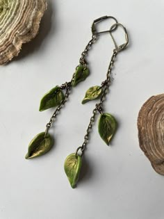 May the leaves whisper wisdom to you straight from the source.  As one leaf sheds, a new one is given space to grow 🍃  Each leaf is hand-formed with clay then attached to the antiqued bronze chain. Leaf Earrings Clay, Goblin Core Earrings, Nature-inspired Leaf Shaped Brass Jewelry, Earthy Clay Earrings, Handmade Bronze Leaf Jewelry, Nature Inspired Earrings, Useful Clay Ideas, Goblincore Accessories, Leaf Clothes