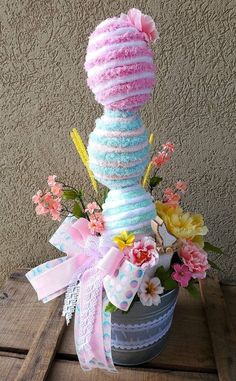 a vase filled with flowers on top of a wooden table