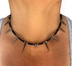 "This spiked skull necklace is gorgeous.  Looks great with any outfit. It features 4mm Swarovski bicone crystal beads in black and rainbow metallic, 5x7mm gunmetal skull, 1\" gunmetal colored acrylic spikes, and lobster claw clasp * 4mm Swarovski Bicone Crystal Beads * 5x7mm Gunmetal Skulls * 1\" Gunmetal Colored Acrylic Spikes * Lobster claw clasp This necklace measures 16.5\" If you would like a different size pick from drop down menu  This necklace comes with a white box, ready for gift givin Crystal Spikes, Goth Necklace, Colored Acrylic, Spike Necklace, Necklace Swarovski, Skull Necklace, Beaded Skull, Necklace Beaded, Wedding Jewellery Necklace