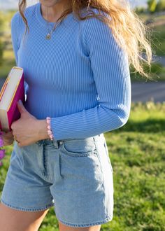 This is such a good go-to top for the spring and summertime. It looks so good on its own, but it's also amazing when it comes to layering with other pieces. The fit is stretchy, comfortable and flattering all at once! hal is 5'8 and wearing a size M size S: 18.5" length, 17" width size M: 18.5" length, 19" width size L: 19" length, 21" width width measurement = armpit to armpit while lying flat paired with the drawing hearts in the byline shorts this fabric is viscose and polyester with lots of Everyday Blue Ribbed Tops, Fitted Knit Top For Spring Layering, Chic Stretch Blue Knit Top, Spring Stretch Ribbed Knit Top, Chic Light Blue Spring Knit Top, Chic Light Blue Knit Top For Spring, Spring Ribbed Knit Top For Day Out, Trendy Solid Color Knit Top For Spring, Trendy Solid Knit Top For Spring