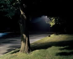 an empty parking lot at night with the lights on