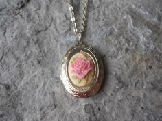 Beautiful cameo locket!!!  The cameo is a gorgeous Rose, choose pink or brown, many other styles and colors available in my shop, so please do browse!!!  The locket is gold plated, victorian style with beautiful scroll on the front and back.  It can hold two photos, keepsakes, or even your daily medication or vitamins!!! The chain is 20" gold plated link chain with a lobster claw clasp!!! Perfect  for Brides or Bridal parties.  Makes a unique memorable gift for any occasion!!!  Timeless classic Vintage Rose Necklace For Wedding, Vintage Pink Jewelry For Keepsake, Vintage Pink Keepsake Jewelry, Personalized Pink Locket Necklace Gift, Personalized Pink Locket Necklace For Gift, Pink Medallion Jewelry Gift, Pink Medallion Jewelry For Gifts, Vintage Rose-colored Jewelry For Gifts, Pink Medallion Jewelry As A Gift