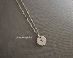 I really like this! Minimalist Hand Stamped Initial Necklace, Minimalist Stainless Steel Necklaces With Charms, Silver Minimalist Personalized Initial Necklace, Minimalist Silver Initial Necklace, Minimalist Hand Stamped Initial Necklace For Everyday, Minimalist Everyday Hand Stamped Initial Necklace, Silver Minimalist Initial Necklace, Minimalist Round Disc Initial Necklace For Gift, Minimalist Round Disc Initial Necklace As Gift