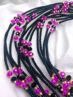 "Maasina" 🌟, a single-strand waist bead that beautifully merges tradition and contemporary allure. Crafted with love and skill, Maasina is more than a bead; it's a journey, a celebration of strength, femininity, and cultural richness. ✨ Black Seed Beads: Symbolize strength, individuality, and timeless elegance. Embrace the depth of your uniqueness with the empowering shade. 💖 Fuchsia Crystal Accents: Add a pop of vibrancy and femininity to your style. Infuse energy and passion into every step you take. 🌟 Gold Glass Seed Beads: Elevate your look with subtle brilliance and sophistication. Symbolize prosperity, creating a link to cultural heritage. Maasina isn't just a waist bead; it's a tapestry of your story, handwoven with cultural threads. The single-strand design ensures comfort and s Black Waist Beads, Waist Jewelry, Strong Hand, Waist Beads, Dreadlock Hairstyles, Black Seed, Every Step You Take, Hairstyles Black, Glass Seed Beads