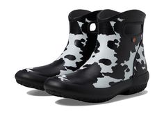 Bogs Patch Ankle - Cow - Women's Boots : Black/White : Keep your feet warm and dry while offering them the desired protection from rain, snow, and wind wearing the Bogs Patch Ankle - Cow Boots. These are 100% waterproof and feature an ultra-soft and flexible rubber upper with a unique animal print for an eye-catching appeal and a removable, contoured BLOOM ethylene vinyl acetate footbed for exceptional comfort with every step. With the Bogs Max-Wick technology, the boots evaporate sweat to keep feet dry. DuraFresh natural bio-technology activates to fight odors. Pull-on handles for easy on and off. Round toe. Built-in heel kick for hands free removal. Flexible and slip-resistant rubber outsole. Imported. Measurements: Weight: 1 lb 1.85 oz Shaft: 6 in Product measurements were taken using s White Waterproof Rain Boots For Winter, White Insulated Fall Boots, White Rain Boots For Winter Outdoor Use, White Winter Rain Boots For Outdoor, Casual White Waterproof Boots For Fall, Casual White Rain Boots For Outdoor, Casual White Waterproof Boots, White Weatherproof Rain Boots For Outdoor, Casual White Rain Boots For Winter