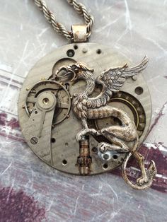 Griffin Steampunk Necklace  #Steampunk #newfromold #ilm #vintagejewelry #industrialdesign #steampunkart #neovictorian #handmade #steampunkjewelry #timlesstreasure Steampunk Diy Crafts, Steampunk Pocket Watch, Steampunk Couture, Steam Punk Jewelry, Industrial Jewelry, Pocket Watch Antique, Fairy Necklace, Steampunk Necklace, Antique Watches