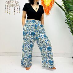 "Cotton Palazzo Pants, Summer Flowy Pants, Women Bohemian Trousers with Pockets, Spring Loose Hippie Lightweight Pants, Floral Prints Hit the summer in style with these lightweight floral Palazzo pants. Featuring bohemian-inspired prints and cotton fabric, the trousers provide all-day comfort with chic and boho flair. The flowy cuts and pockets allow for complete freedom of movement, so you can stay cool and stylish. Handmade Material: Organic Cotton  Size: Free Size and Plus Size Adjustable Waist Two Side Pockets Free Size: Length- Approx. 38\"                   Waist- Approx. 26\" to 40\"                    Hips- Approx. 44\"                   Inseam- Approx. 28\" Plus Size:  Length- Approx. 38\"                   Waist- Approx. 32\" to 48\"                   Hips- Approx. 48\" Bohemian Ankle-length Wide Leg Pants For Vacation, Bohemian Bottoms With Pockets For Vacation, Bohemian Floral Print Beach Bottoms, Bohemian Floral Beach Bottoms, Hippie Style Floral Print Wide Leg Pants, Hippie Style Wide Leg Floral Print Pants, Casual Boho Print Pants For Vacation, Hippie Wide Leg Floral Print Bottoms, Hippie Wide Leg Bottoms With Floral Print