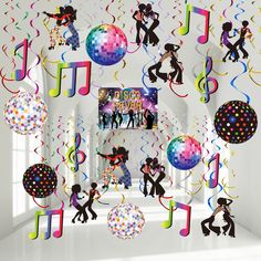 party decorations with musical notes, balloons and streamers in the shape of people dancing