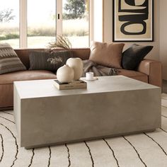 This modern concrete coffee table embodies minimalistic elegance with its sleek, rectangular shape and matte finish. Crafted from durable concrete, it offers a contemporary aesthetic that complements various décor styles. Its clean lines and robust structure create a striking focal point in any living space. Perfectly suited for modern interiors or exterior spaces, this coffee table enhances your lounge area with understated sophistication. AllModern Color: Gray AllModern Polly 51" Concrete Coffee Table in Gray | Size 16.5" H X 31.5" W X 51" L Concrete Coffee Table, Coffee Table Brown, Grey Coffee, Coffee Table Grey, Colour Gray, Outdoor Coffee Table, Stone Concrete, Brown Stone, Outdoor Coffee Tables