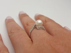 This elegant and timeless pearl and diamond white gold ring is a must-have in a woman's wardrobe. It goes perfectly with almost anything Beautiful real Japanese pearl and real diamonds The pearls is white, smooth and shiny with high luster White and clean diamonds H/VS Hand made * genuine Japanese Akoya cultured pearl * 7.5 mm in diameter * round in shape * very high luster * grade AAA * 18K White gold * 0.23 carats total weight of real diamonds * quality H color VS clarity * ring made in Italy White Pearl Rings With Diamond Accents, Diamond White Akoya Pearl Ring For Anniversary, Pearl Rings With Brilliant Cut For Anniversary, Elegant Diamond White Pearl Wedding Ring, Diamond White Brilliant Cut Akoya Pearl Ring, Diamond White Akoya Pearl Ring With Brilliant Cut, Wedding Rings With Akoya Pearl And Diamond Accents, Elegant Pearl Ring With Diamond Accents For Wedding, Akoya Pearl Rings With Diamond Accents For Wedding