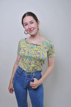 Vintage multicolor summer blouse, 90s green pullover shirt, Size M Welcome to TARASCOMMON.ETSY.COM Unique clothing from the 20th century. Model tall - 170cm. Size: M. Sleeve - 7cm / 2.75inch; ( armpit to end of sleeve); Width - 42cm / 16.53inch; Length - 54cm / 21.25inch. All measurements are taken seam to seam while lying flat. Polyester. This item is vintage, so it can have some defects. Additional photos can be send We are glad that you are interested in lots that we sell. Wish you a good sho Green 90s Style T-shirt For Summer, Retro Green Printed T-shirt, 90s Style Printed T-shirt For Spring, Spring Casual Blouse With Retro Print, Casual Spring Blouse With Retro Print, Fitted Vintage Print T-shirt For Spring, Casual Retro Print Blouse For Spring, Casual Blouse With Retro Print For Spring, Summer Multicolor Stretch T-shirt