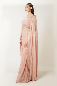 Blush pink georgette blouse with an attached dupatta and sequins, thread and zari embroidery. Comes with box-pleated palazzo.
Components: 2
Pattern: Embroidered
Type Of Work: Sequins, Thread, Zari
Neckline: High Neck
Sleeve Type: Flared Sleeves
Fabric: Georgette
Color: Pink
Other Details: 
Closure: Blouse - Back hooks
Occasion: Sangeet - Aza Fashions Pink Georgette Sets With Cutdana, Pink Pre-draped Floor-length Saree For Navratri, Pink Floor-length Pre-draped Saree For Navratri, Pink Chinon Pre-draped Saree For Navratri, Pink Georgette Sets With Traditional Drape, Pink Floor-length Blouse Piece With Sheer Dupatta, Semi-stitched Blouse With Sheer Dupatta For Reception, Pink Floor-length Pre-draped Saree With Cutdana, Pink Floor-length Pre-draped Saree For Eid