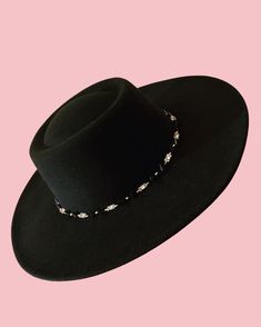 The Tanami hat features a wide brim, and carefully sewn in beads, silver metal Tibetan pieces, and metal studs around the brim.  Its a truly versatile piece which can be worn every day to elevate your outfit, or dressed up for a fancier occasion!  Size medium/large (can be fit to smaller heads by adjusting the band on the inside, and small hat padding may also be added) max 60cm circumference Adjustable Embellished Hat For Festivals, Adjustable Embellished Festival Hats, Adjustable Rhinestone Hat Bands For Festivals, Party Fedora With Adjustable Flat Crown, Adjustable Flat Crown Fedora For Party, Elegant Rhinestone Hats For Festival, Elegant Rhinestone Festival Hats, Beaded Hat With Curved Brim, Festival Fedora Hats With Rhinestones