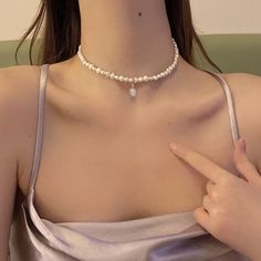 Sweet baroque pearl necklace At first sight, this baroque pearl choker can make people directly feel the meaning of sweet, delicate, and elegant. If you're looking for a real pearl necklace to go with your off-the-shoulder dress, square-neck tee, or anything without a collar, this is the right pearl necklace for women to wear. With a small but noticeable size, this 5-6mm baroque freshwater pearl necklace looks shiny and personal. The baroque pearl choker also comes with an eye-catching design: a Dainty Baroque Pearl Necklace In Pearl White, Pearl White Baroque Pearl Choker Necklace, Baroque Pearl Choker Necklace In Pearl White, Baroque Pearl Choker Necklace With Pearl Charm, Baroque Pearl White Choker Necklace, White Baroque Pearl Necklace With Clavicle Chain, Delicate Pearl Choker With Pearl Charm, Delicate Pearl Choker Necklace With Pearl Charm, Delicate Baroque Pearl Necklace With Pearl Charm