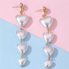 Lend movement-friendly appeal to your look with these drop earrings made from heart-shaped pearls. 0.66" W x 3.54" L 18k gold-plated copper / pearl White Heart Drop Earrings For Mother's Day, Valentine's Day Dangle Pearl Earrings For Pierced Ears, White Heart-shaped Pearl Earrings For Valentine's Day, White Pearl Earrings For Valentine's Day Party, Valentine's Day Dangle Pearl Earrings For Party, Valentine's Day White Pearl Earrings, White Heart-shaped Pearl Earrings For Party, Dangle Pearl Earrings For Valentine's Day, Valentine's Day Pearl Drop Dangle Earrings